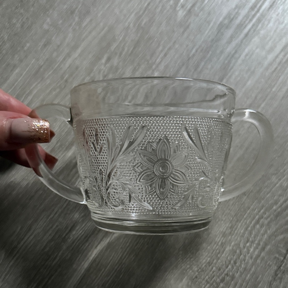Glass sugar dish with engraved flowers and double handle